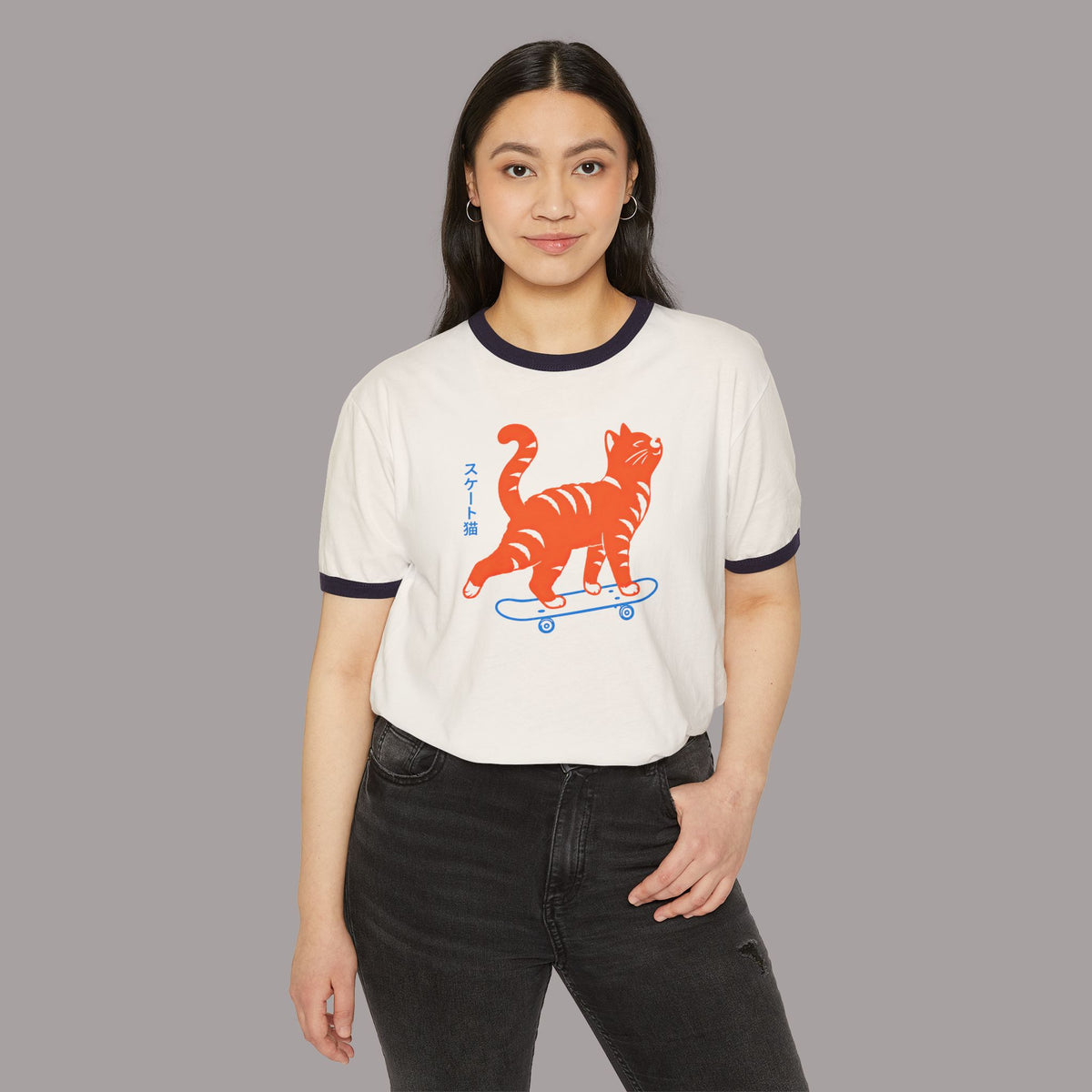 Skateboarding Cat Ringer T‑Shirt — Retro Orange Tabby Skate Tee