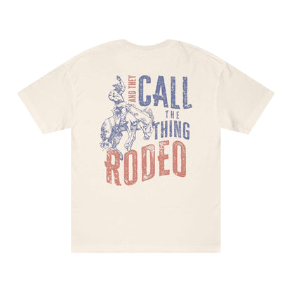 Rodeo Western Cowboy T-Shirt back design featuring a cowboy and horse with distressed print 'And They Call The Thing Rodeo'.