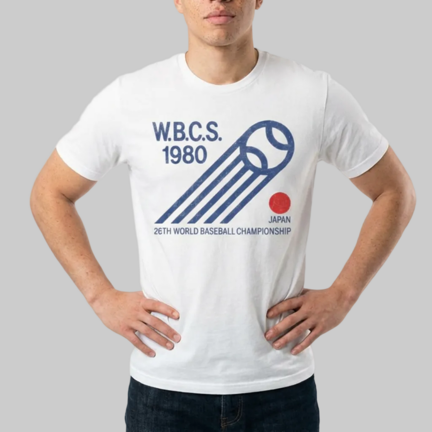 Person wearing a white t-shirt with WBCS 1980 design on a plain background