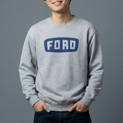 Person wearing a gray Ford sweatshirt against a gray background
