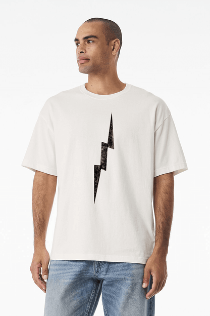 Model wearing distressed lightning bolt t-shirt, white relaxed-fit tee with centered worn-in black lightning graphic