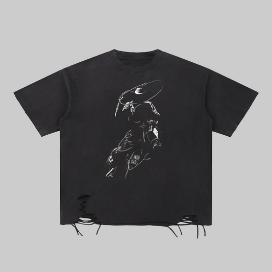 A black short-sleeve t-shirt with a distressed, raw hem featuring frayed edges and lace-up details. The front is printed with a white graphic illustration of a figure in a cowboy hat.