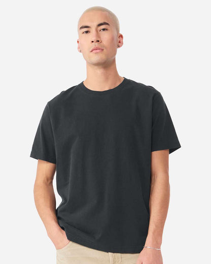 Model wearing black unisex heavyweight washed cotton t-shirt, relaxed fit heavy weight tee with semi-drop shoulders