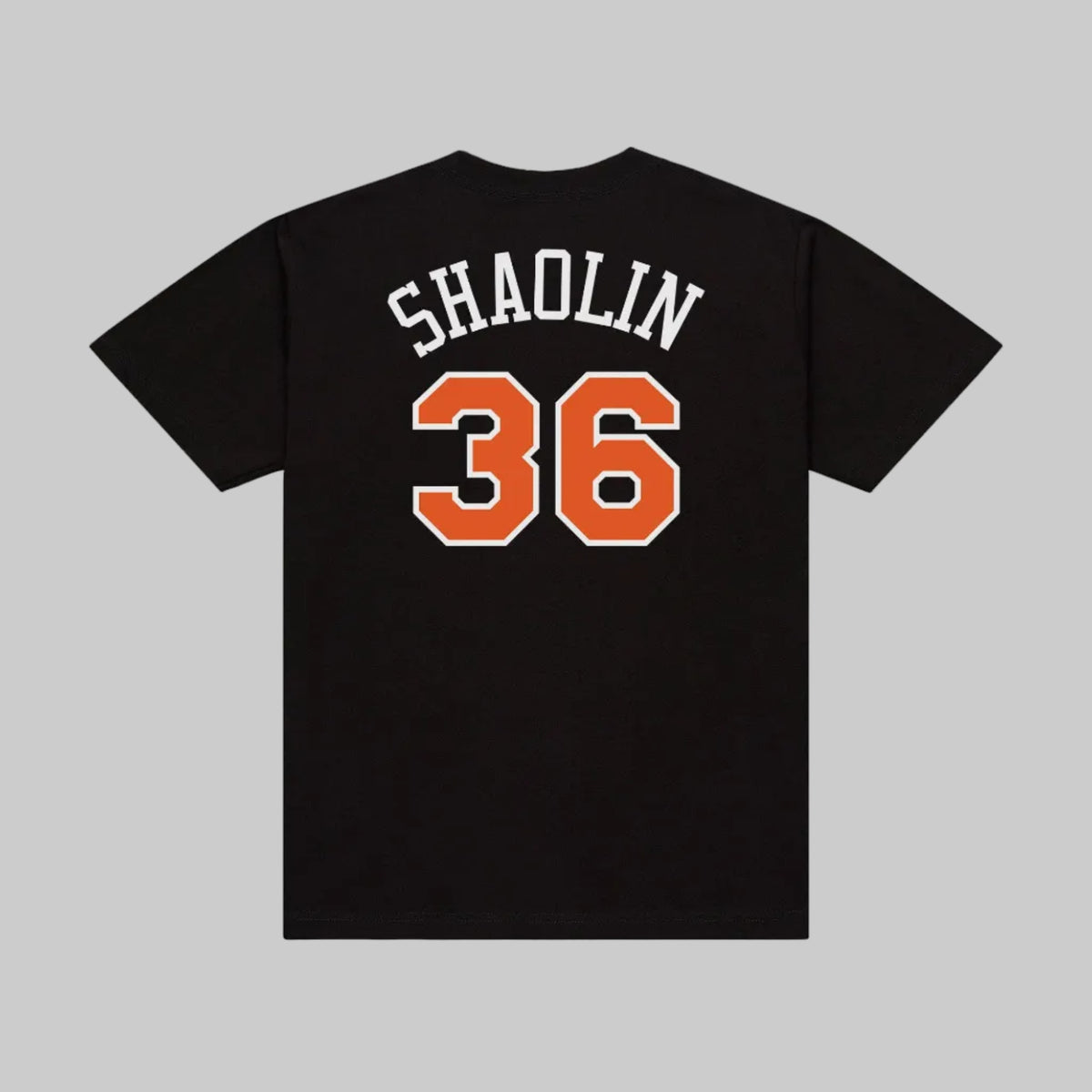 Black short-sleeve T-shirt shown from the back with 'SHAOLIN' in white varsity-style letters and the number '36' in orange with a white outline.