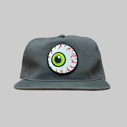 Gray cap with a unique eye design patch on a white background