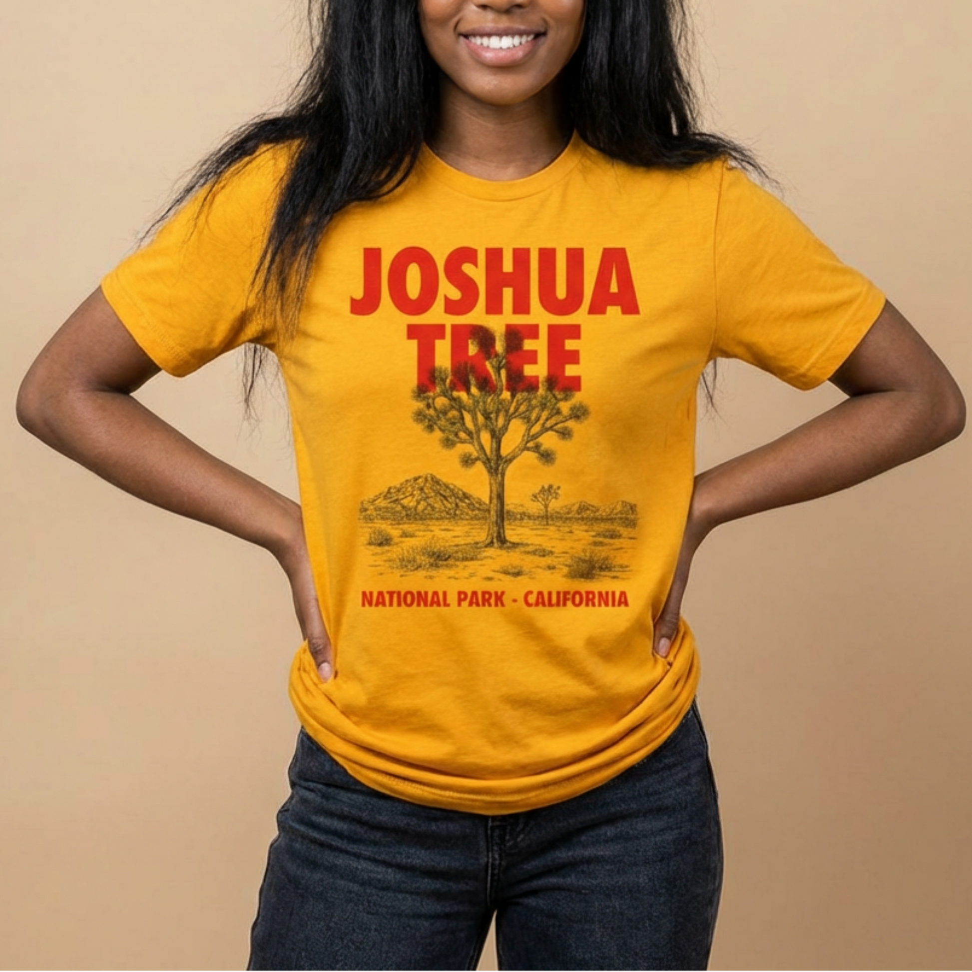 Person wearing a yellow 'Joshua Tree National Park, California' t-shirt against a beige background