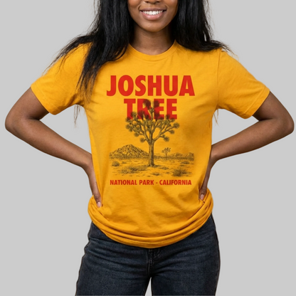 Person wearing a yellow 'Joshua Tree National Park, California' t-shirt against a beige background