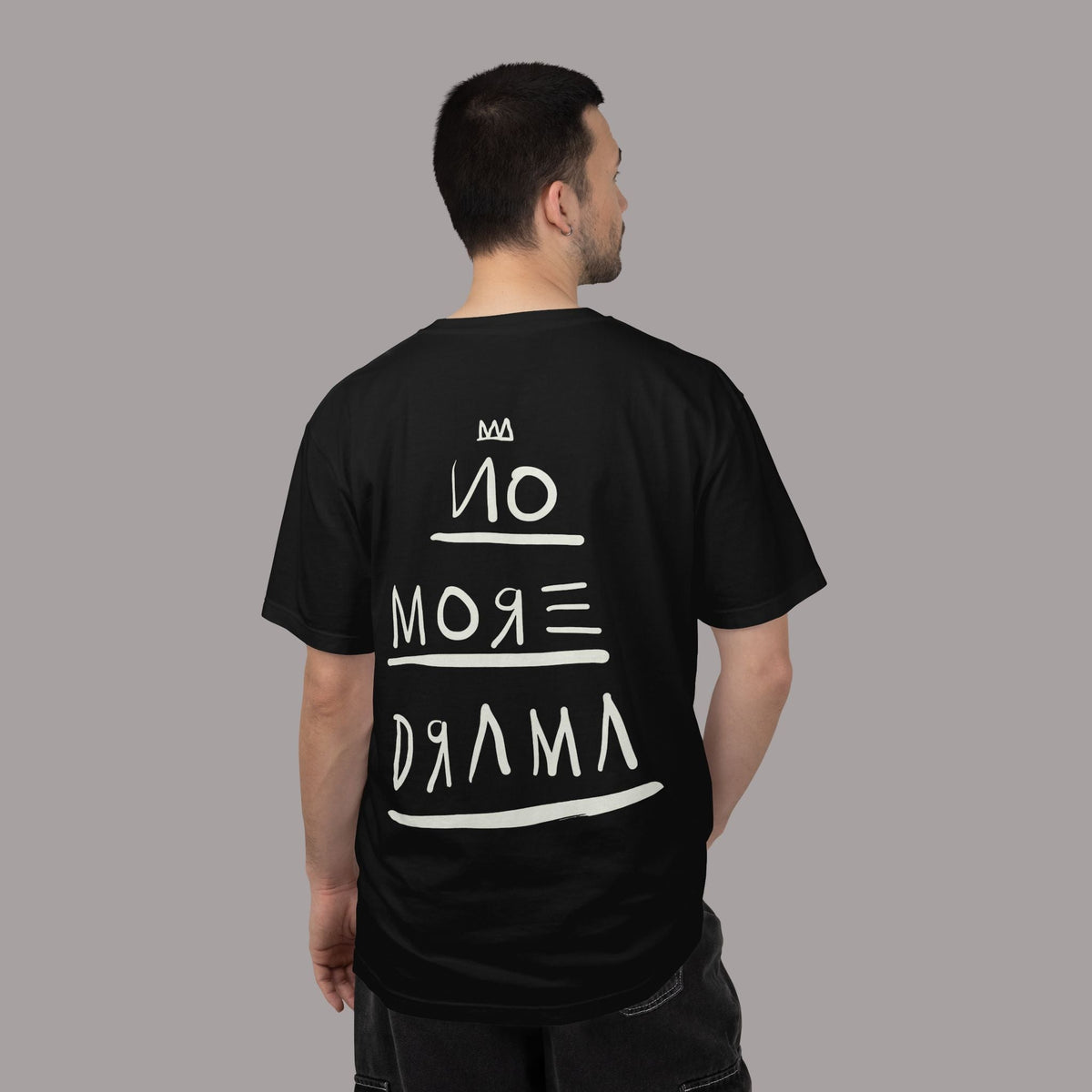 KILLER RETRO black graphic tee with white No More Drama text on the back, worn by a man in a relaxed fit.