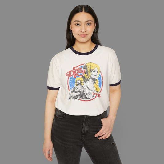 KILLER RETRO cream ringer t-shirt with navy trim and a vintage Dolly 1972 graphic print worn by a woman.