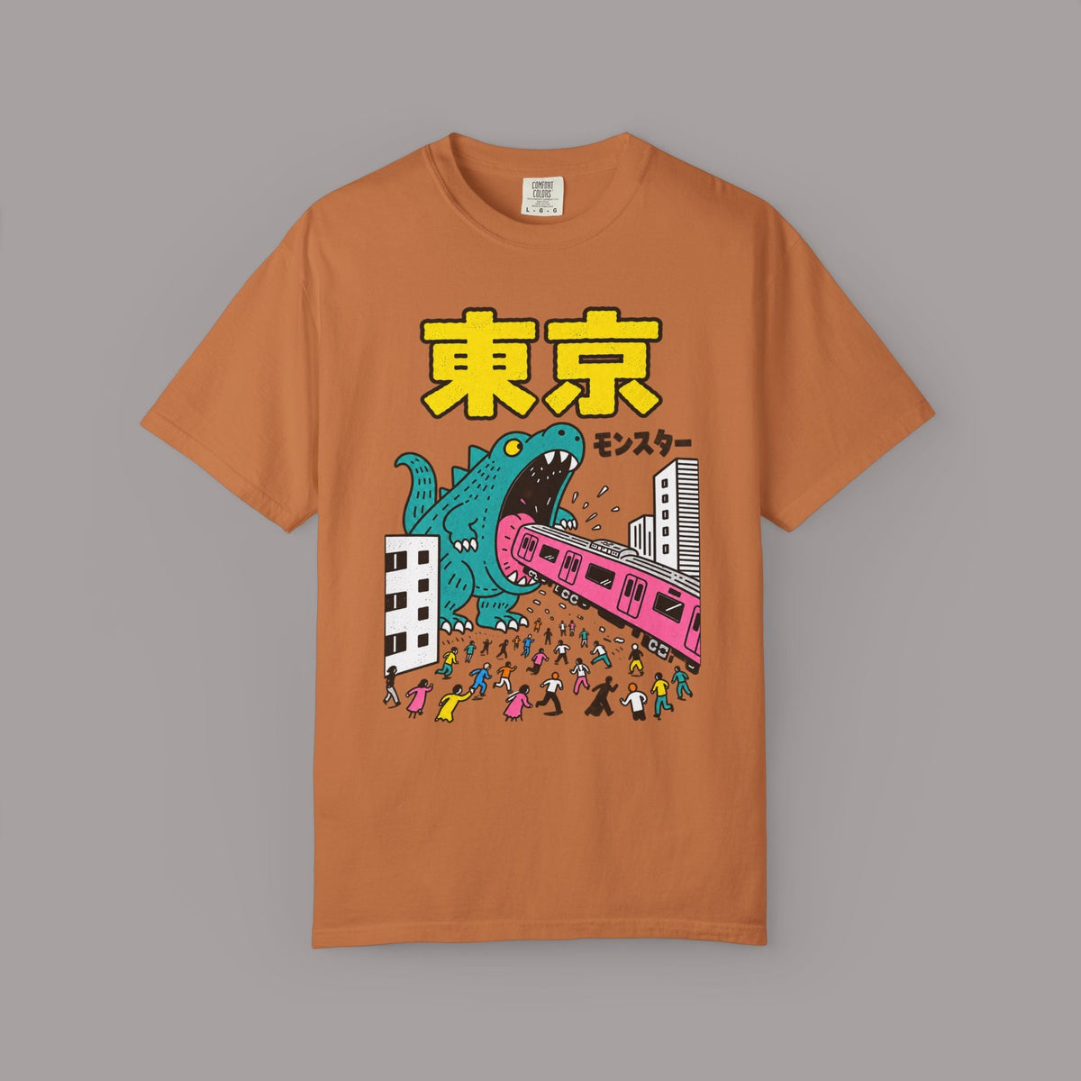 KILLER RETRO heavyweight cotton t-shirt in burnt orange featuring a teal kaiju monster attacking a Tokyo city scene.
