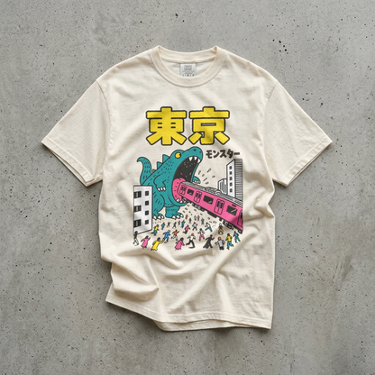 KILLER RETRO heavyweight cotton t-shirt in off-white featuring a teal kaiju monster and pink train graphic.