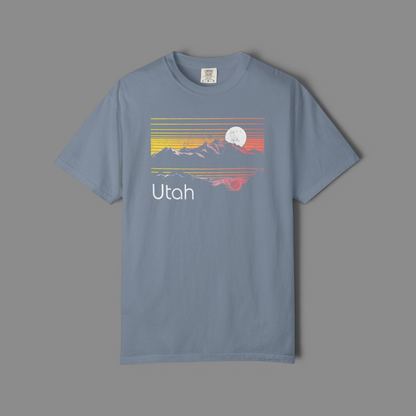 KILLER RETRO blue garment-dyed cotton t-shirt featuring a vintage Utah mountain sunset graphic with a moon.
